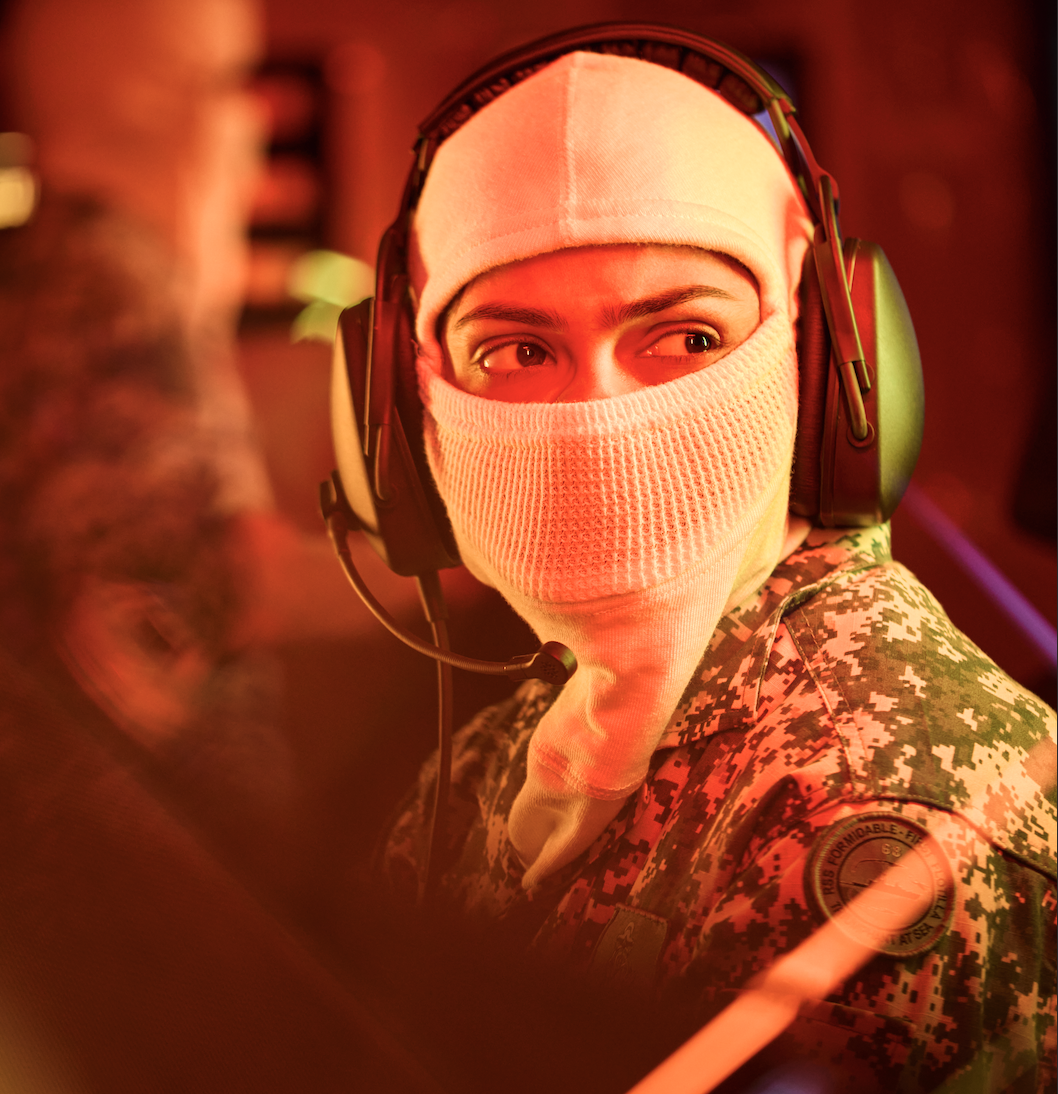 Naval Warfare System Experts operating control consoles in a vessel's command centre.